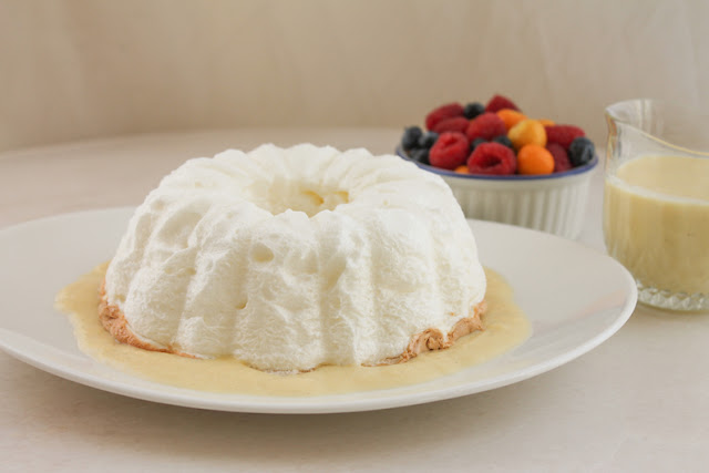 Food Lust People Love: A fun and easy twist on the original French dessert called îles flottantes, this floating island Bundt features meringue baked in a Bundt pan, served with fresh fruit and crème anglais, a pourable vanilla custard.