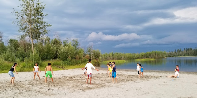 kids playing at the beach in Tanana Lakes