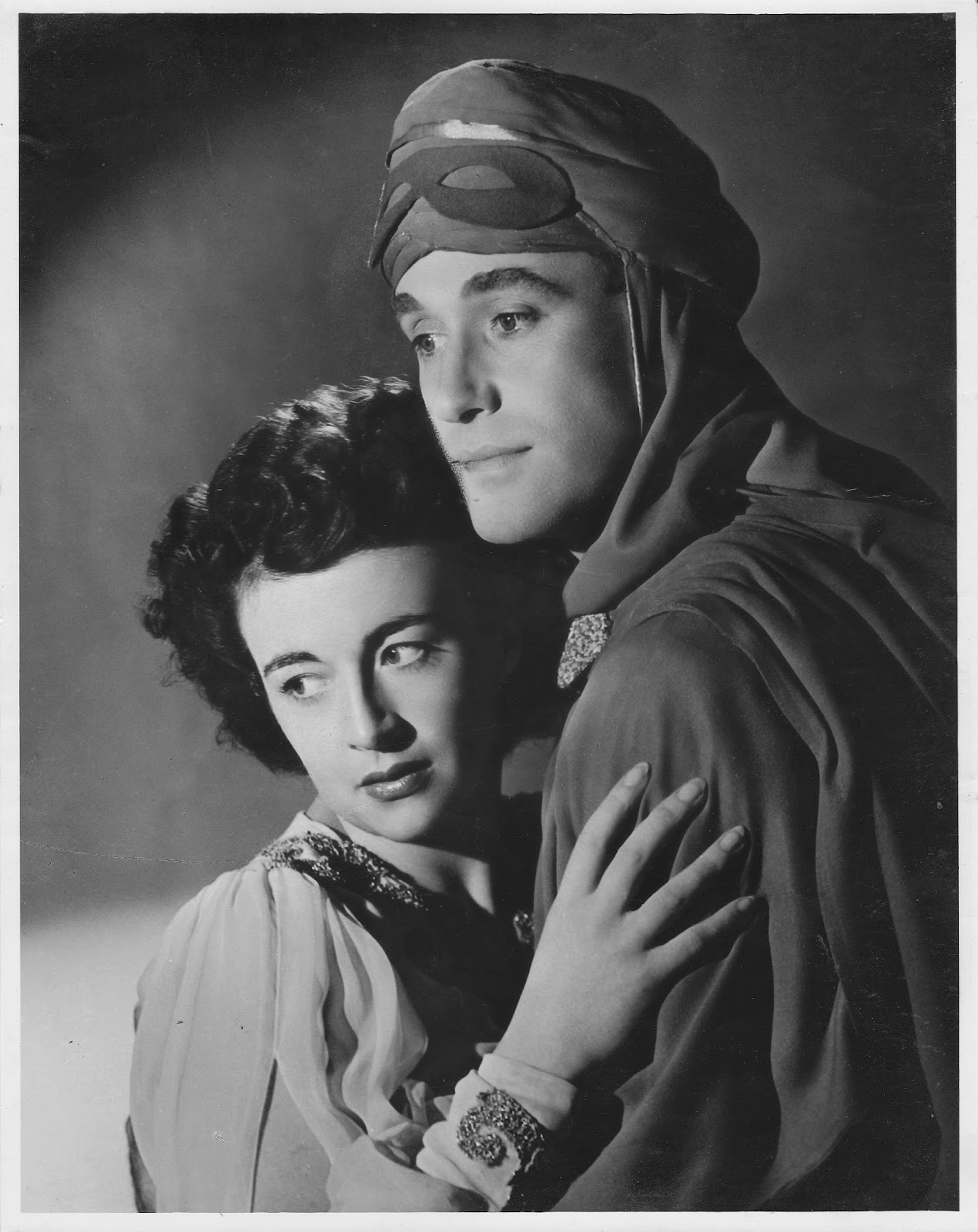 What a looker! Max Oldaker as The Red Shadow in The Desert Song with co-star Joy Beattie. 1945