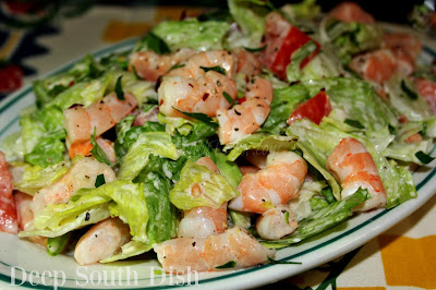 A very simple salad made with cooked shrimp, iceberg lettuce, fresh tomatoes and dressed with mayonnaise.