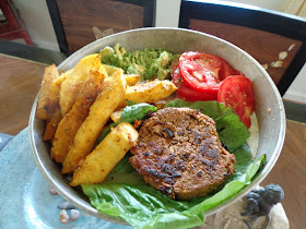 sprouted raw vegan or vegan black bean burgers with jicama fries, avocado and tomatoes