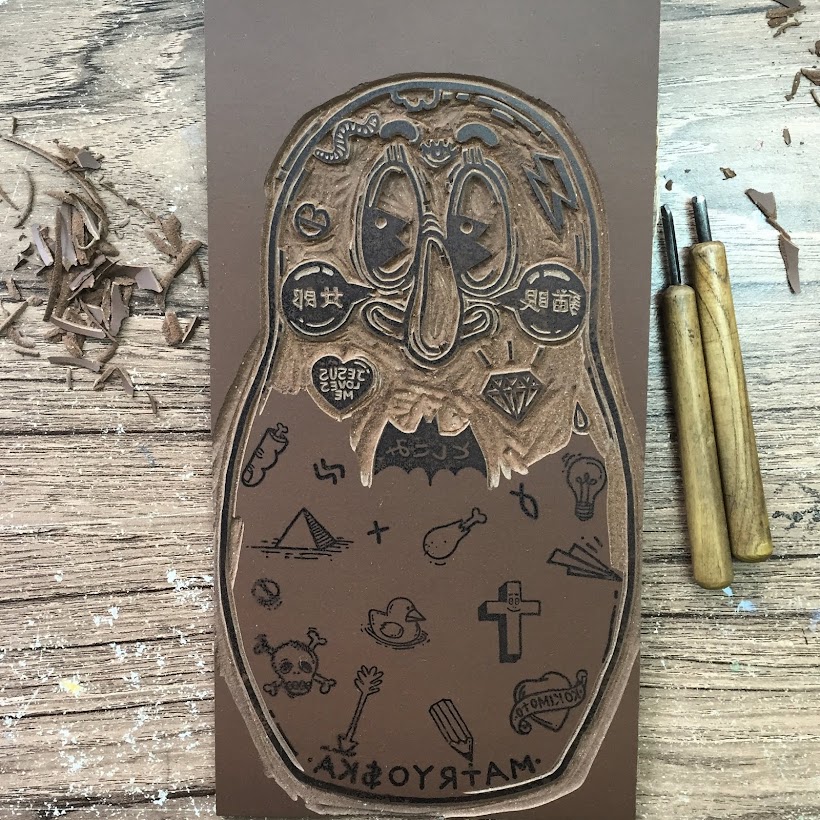Carving a lino block for MATRYO$KA Linocut Edition