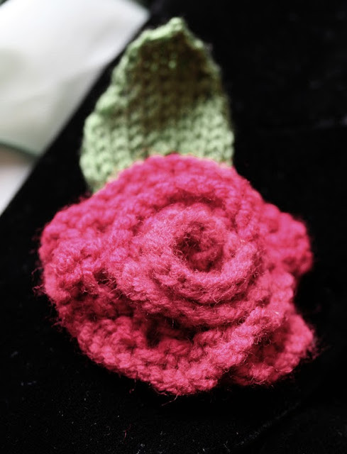 Rambling Rose Free Knitting Pattern finished and worn on black velvet coat