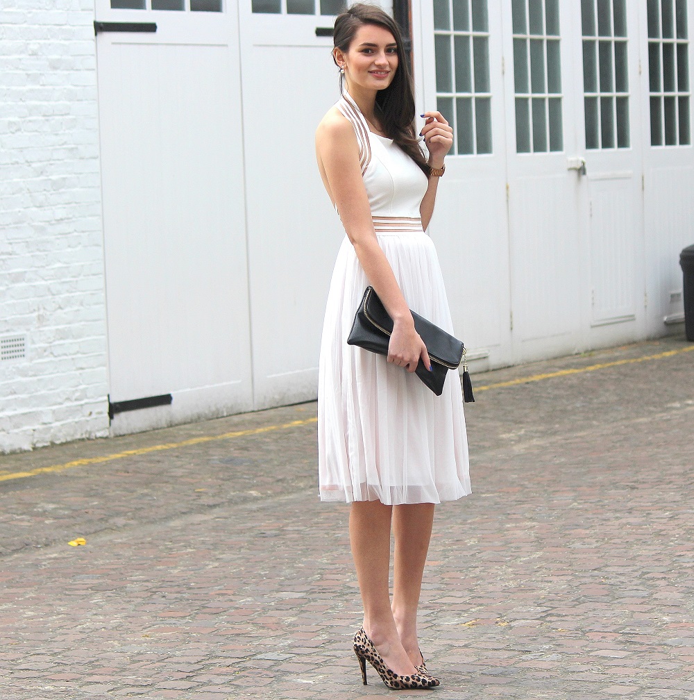 peexo fashion blogger wearing white backless dress and leopard print heels and black clutch in spring