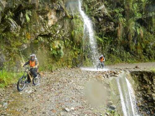 Riding Through the Waterfall Death Road Bolivia Riding Through the Waterfall Death Road Bolivia