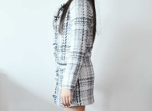 SheIn Fashion Review: Printed Sweater, Houndstooth Skirt, + Tweed Coat An elegant, chic monochrome outfit featuring a Chanel-inspired gridded tweed longline coat, asymmetric houndstooth sheath skirt, and printed mock-neck dip hem sweater from SheIn.