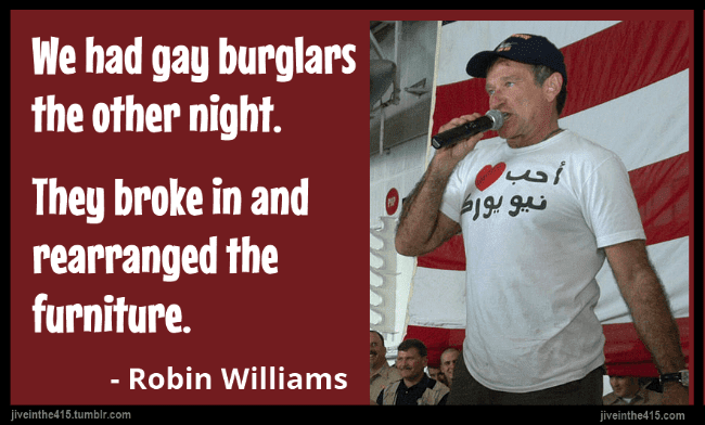 A photo of Robin Williams entertaining the crew of USS Enterprise, December 19, 2003, with the joke "We had gay burglars the other night. They broke in and rearranged the furniture."