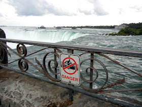 A warning sign at the Niagara Falls A warning sign at the Niagara Falls