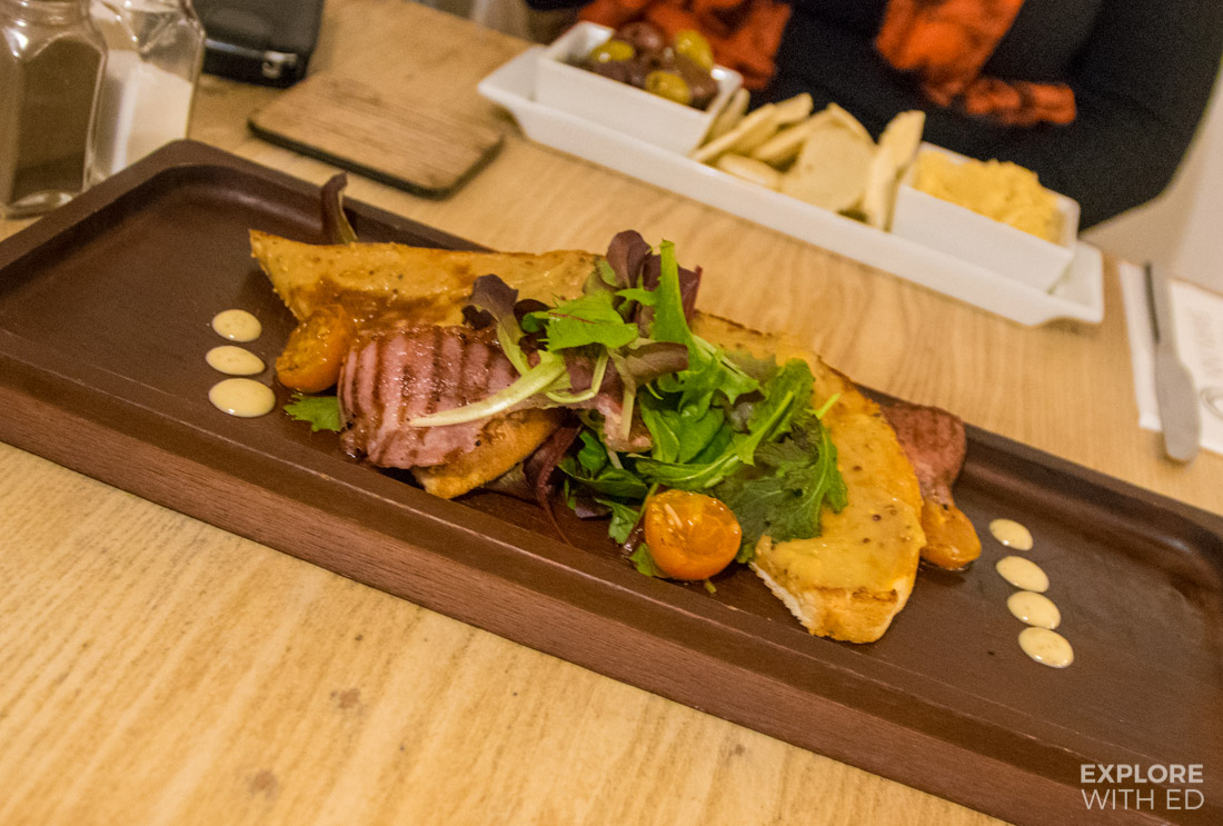 Welsh Rarebit with salad and crispy bacon