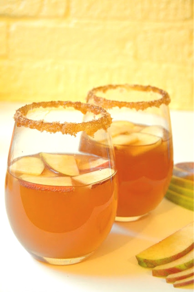 This 5-minute-or-less caramel apple cider cocktail is perfect for any fall day with a caramel-brown sugar rim for sweetness! www.nutritionistreviews.com