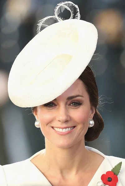 Kate Middleton wore Alexander McQueen cream coatdress. Anne Grand-Clement clutch, Balenciaga pearl earrings. Mathilde Natan lace dress