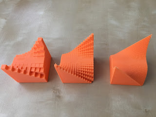 Three, 3D printed models of surfaces, discretized to varying degrees