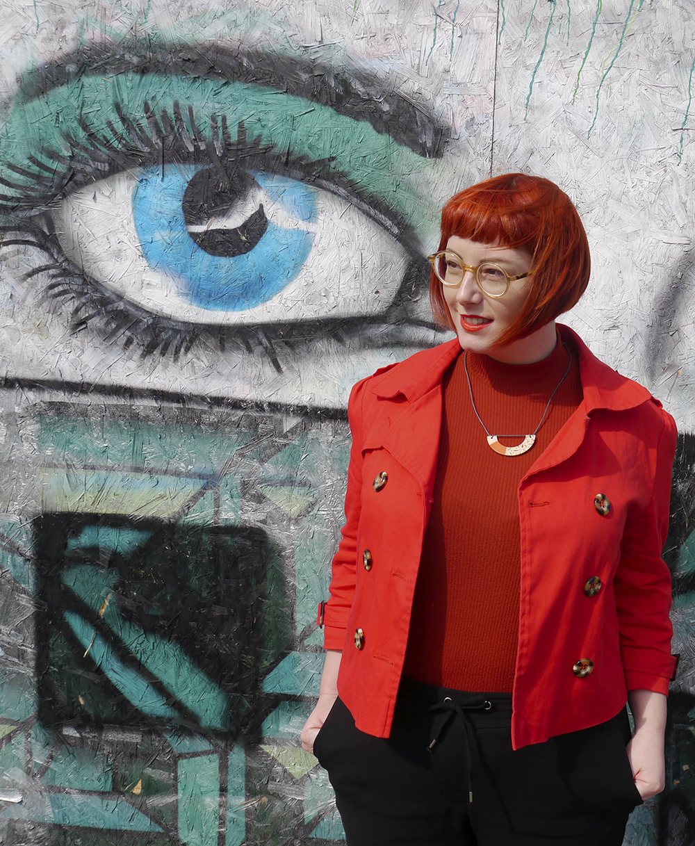 CrossEyes Edinbugh circle glasses with tortoise shell legs Colourful street style from Scottish blogger Helen from Wardrobe Conversations against a colourful graffiti wall with eye design painted in Dundee