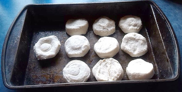 Arrange biscuits in a baking pan.