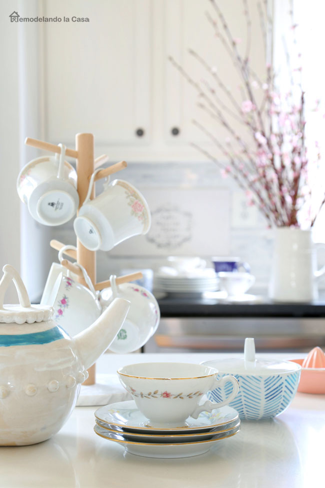 tea set on top of kitchen island - white, blue and pink decor