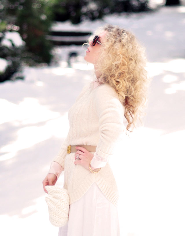 big blonde afro curls, light neutrals in the snow, winter style