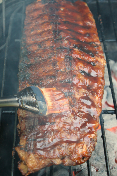 basting the Barbecue Ribs on the grill