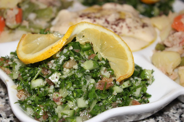 Arabic Tabouleh Salad Arabic Tabouleh Salad in a Platter Decorated by Lemon slice