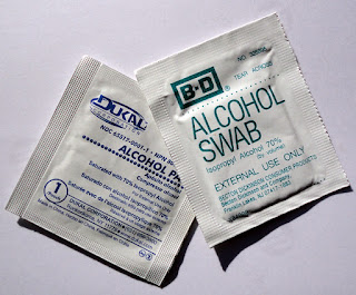packages of foil-wrapped alcohol soaked wipes
