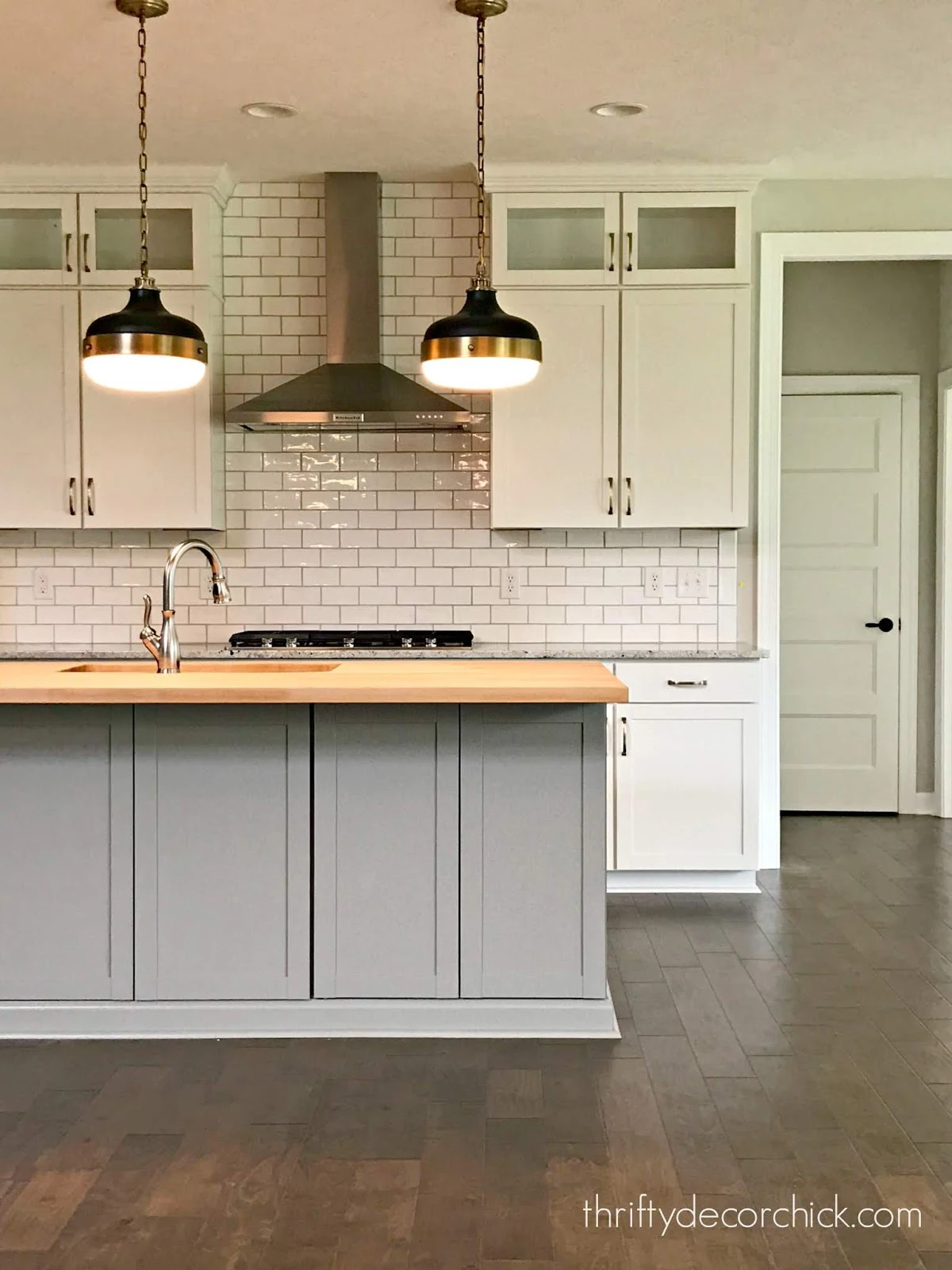 gray and white kitchen with white subway tile