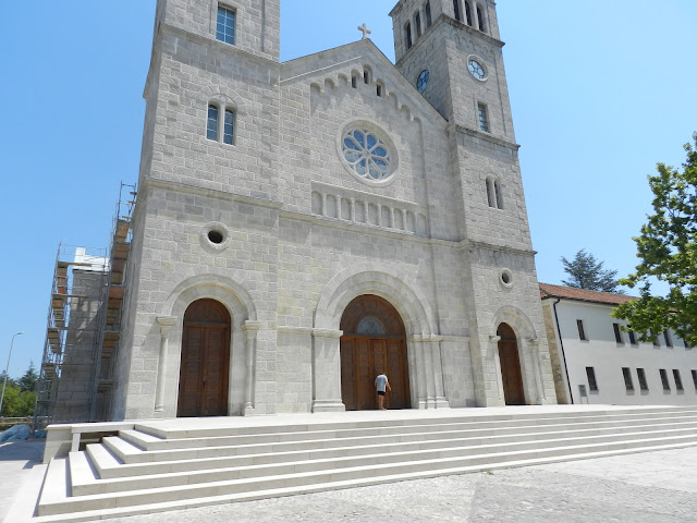 A photo of me at the doors of the Church of the Assumption of the Blessed Virgin Mary