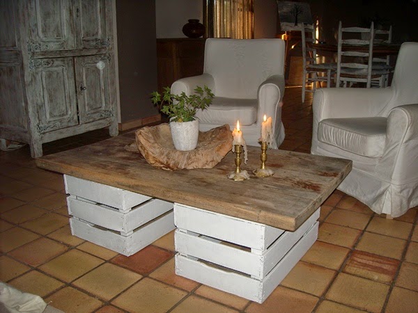 Coffee table with boxes of fruit