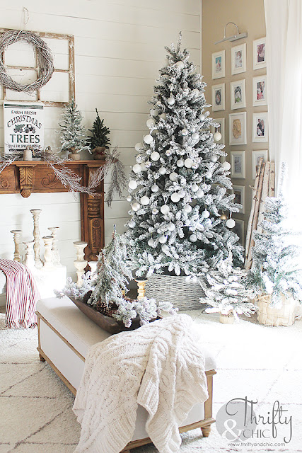 Christmas living room decor and decorating ideas. Christmas decor ideas for dough bowls. Farmhouse Christmas decor. Flocked Christmas trees. Shiplap wall and Christmas. Antique styled wood mantel. Wood mantel Christmas decor.