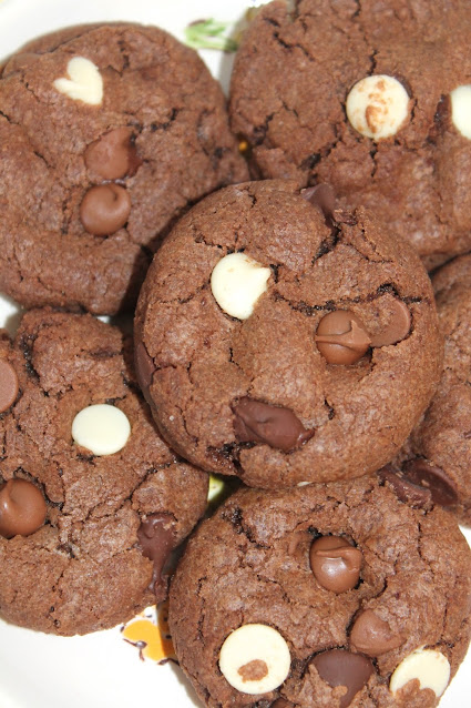 Platter of baked triple chocolate chip chocolate cookies.