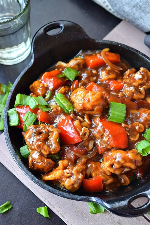 black serving dish having Mushroom Manchurian famous Indo Chinese dish