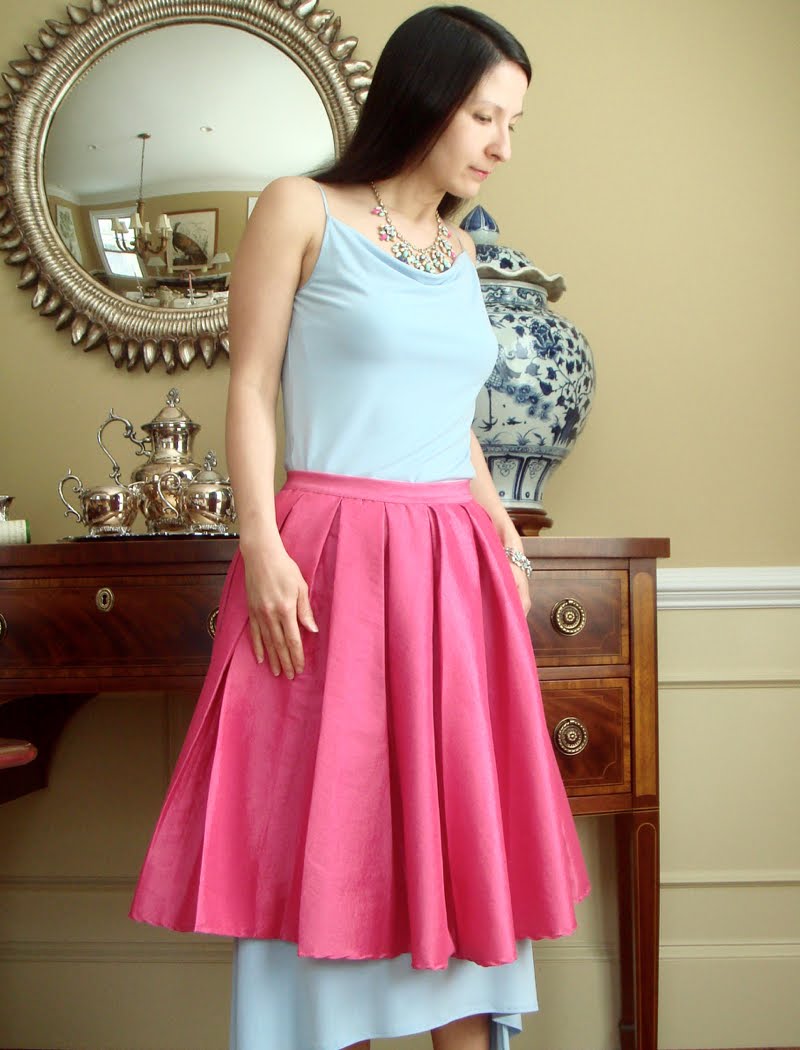 How to Wear a Skirt Over a Skirt How to Wear a Skirt Over a Skirt outfit turned sideways up close in center.