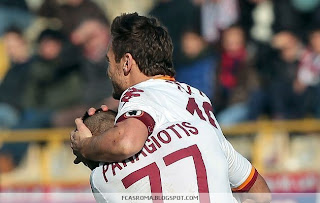 Panagiotis Tachtsidis celebrates with team-mate Francesco Totti after scoring a goal during the Serie A game versus Bologna at Stadio Renato Dall'Ara.