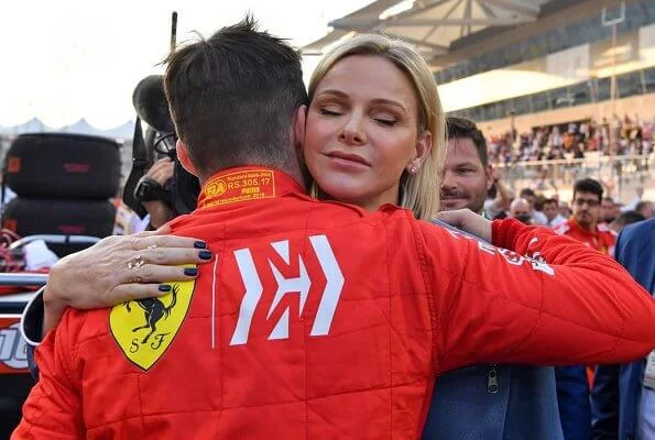 Princess Charlene visited Abu Dhabi to support Ferrari's Monegasque driver Charles Leclerc. blue jumpsuit