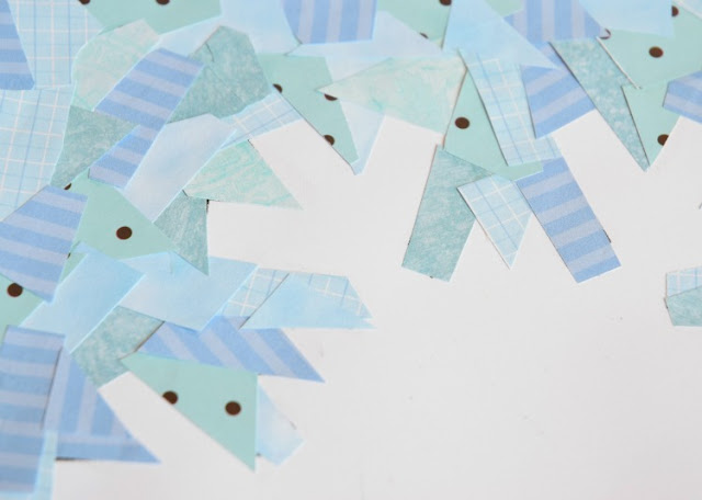 Winter snowflake paper collage craft for kids to show negative space