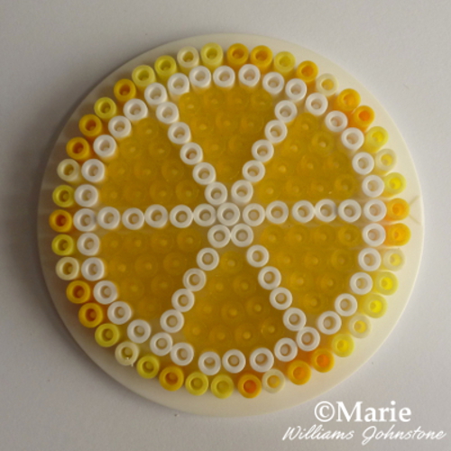 A whole Perler bead fruit slice lemon yellow white fused Hama beads tutorial craft pattern by CraftyMarie