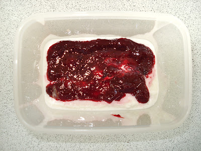 Layer the frozen yogurt and raspberry sauce