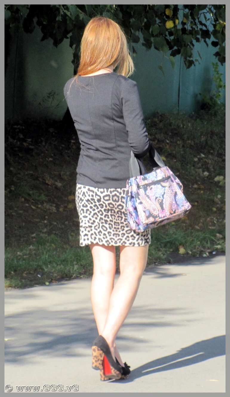 Lady in leopard skirt on high heels
