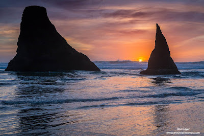 Sunset behind sea stacks at Bandon Beach along the Oregon coast, Oregon, USA.
