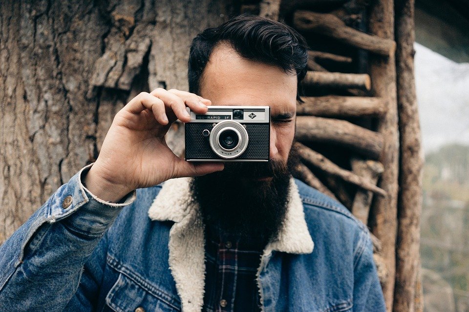 How to Grow a Beard a man taking a picture of himself