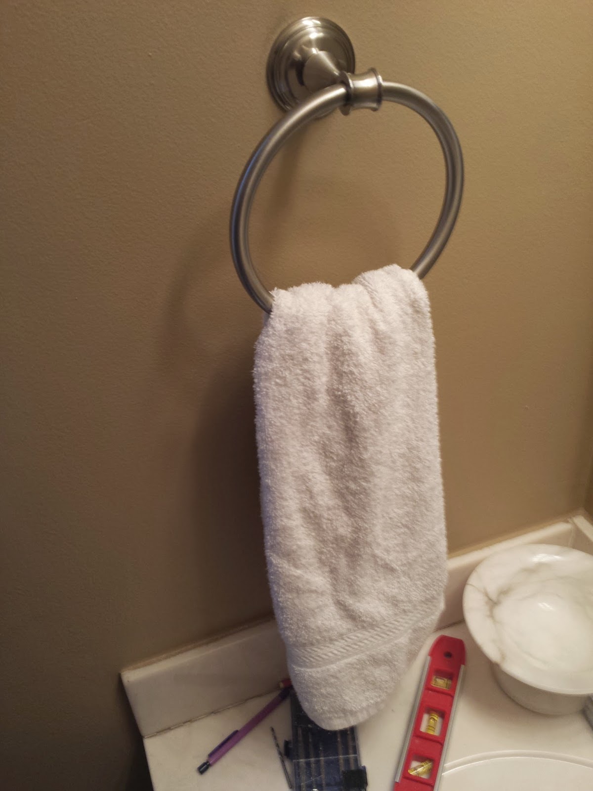 The New Family Future Post Hanging a Towel Rack (or Other Item Onto