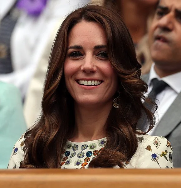 Duchess Catherine at the Men's Final of the Wimbledon. Kate Middleton wore Alexander McQueen Obsession Print Short Sleeve Dress. Brora Gold Charm Earrings, and carried her L.K. Bennett Natalie clutch.