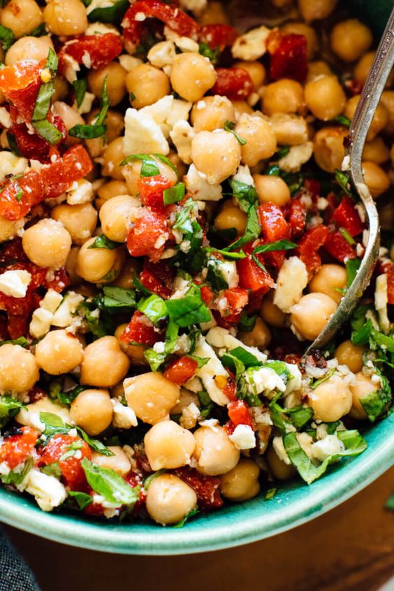 These marinated chickpeas are a little spicy, a little sweet, and totally irresistible. This recipe as great on its own as a light meal or appetizer, or served on salads or inside pitas. Recipe yields about 6 side servings.