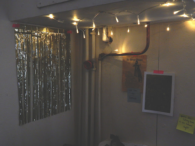 decorations and fairy lights in the corner of a room