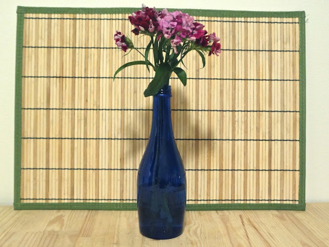 flowers in blue bottle