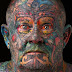 The indelible marks of a very colourful life: The reformed gangster, drug dealer, addict and thief who covered every inch of his body in tattoos - even his EYEBALLS - out of self-loathing (19 Pics)