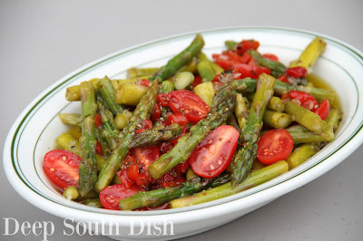 Fresh asparagus, cooked to crisp tender, then marinated in an oil and vinegar seasoned dressing with pimentos, and finished with sliced grape tomatoes.