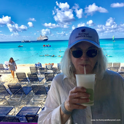 Carole Terwilliger Meyers sips a pina colada on Half Moon Cay, Bahamas