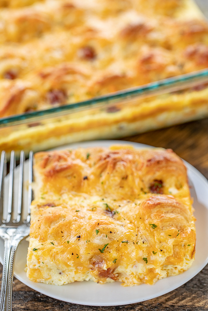 Pigs in a Blanket Breakfast Casserole - seriously the BEST!!! Crescent rolls, dijon mustard, lit'l smokies, cheese, eggs and milk. SO simple and SOOO delicious! Great for breakfast, brunch, lunch, dinner and tailgating! I mean, nothing says football food like pigs in a blanket. Everyone LOVED this easy breakfast casserole. They cleaned their plate and asked for seconds. Success!!! #breakfast #casserole #pigsinablanket #breakfastcasserole Pigs in a Blanket Breakfast Casserole - seriously the BEST!!! Crescent rolls, dijon mustard, lit'l smokies, cheese, eggs and milk. SO simple and SOOO delicious! Great for breakfast, brunch, lunch, dinner and tailgating! I mean, nothing says football food like pigs in a blanket. Everyone LOVED this easy breakfast casserole. They cleaned their plate and asked for seconds. Success!!! #breakfast #casserole #pigsinablanket #breakfastcasserole