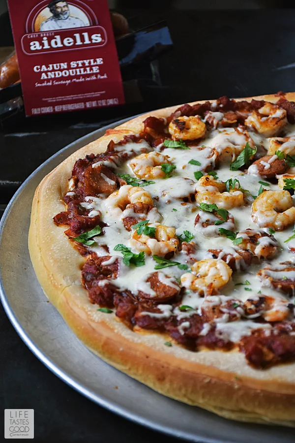 Cajun seasoned shrimp, Andouille sausage, the holy trinity of vegetables, and a zesty sauce all atop a soft and chewy pizza crust makes up this Jambalaya Pizza recipe. Who needs a bowl?! #LTGrecipes