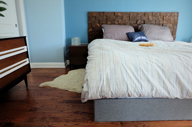 view of faux bed frame box spring cover