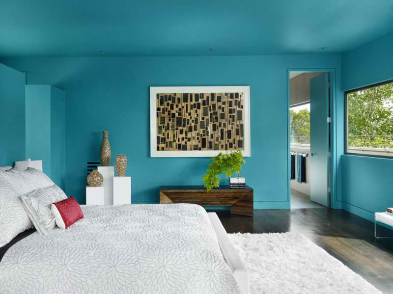 Dormitorio en colores turquesa con una foto Dormitorio en colores turquesa con una foto